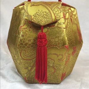 Octagon shape bucket bag with satin print tassel